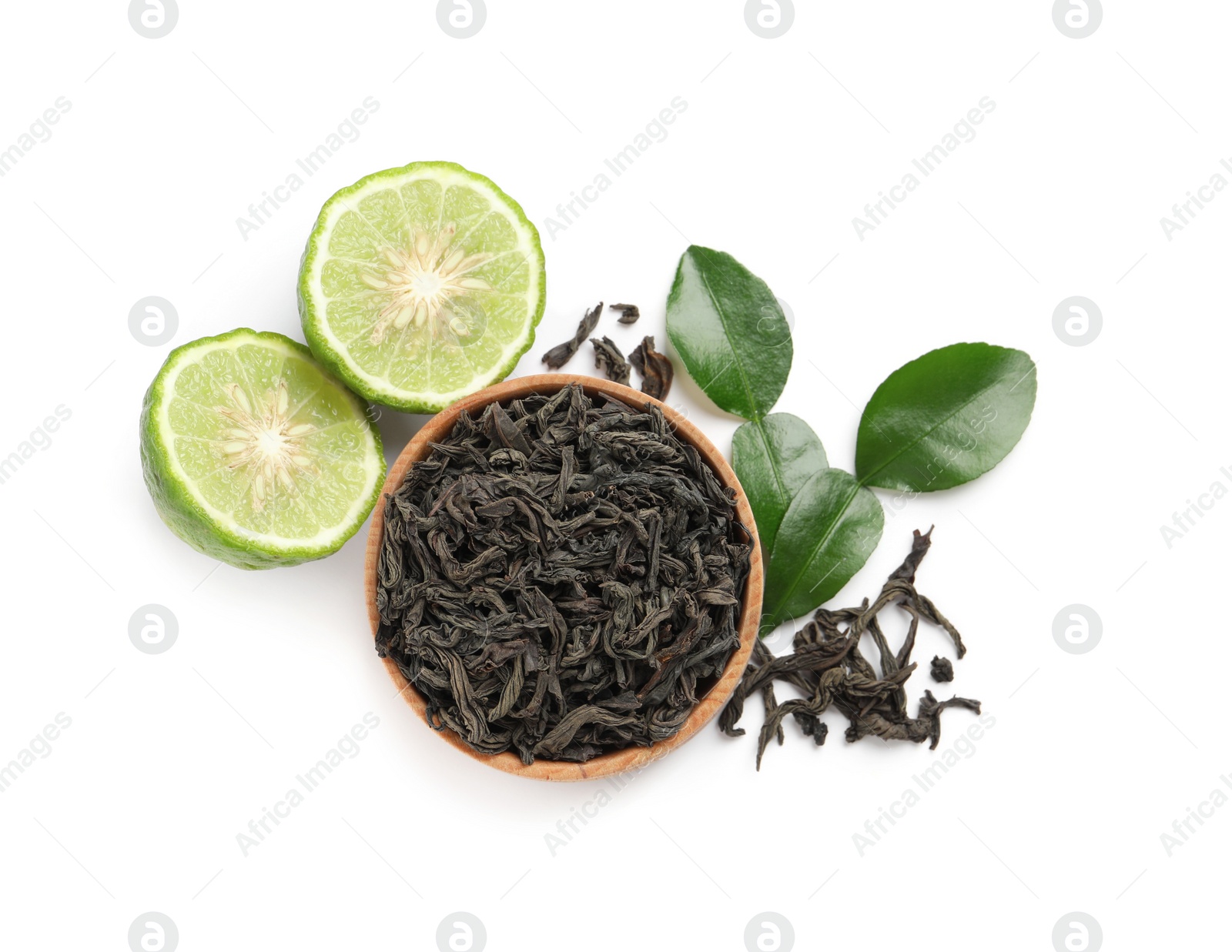 Photo of Dry bergamot tea leaves and fresh fruit on white background, top view