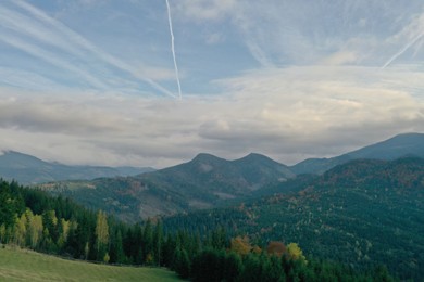 Aerial view of beautiful mountain landscape with forest on sunny day