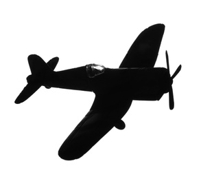 Dark silhouette of vintage toy military airplane on white background