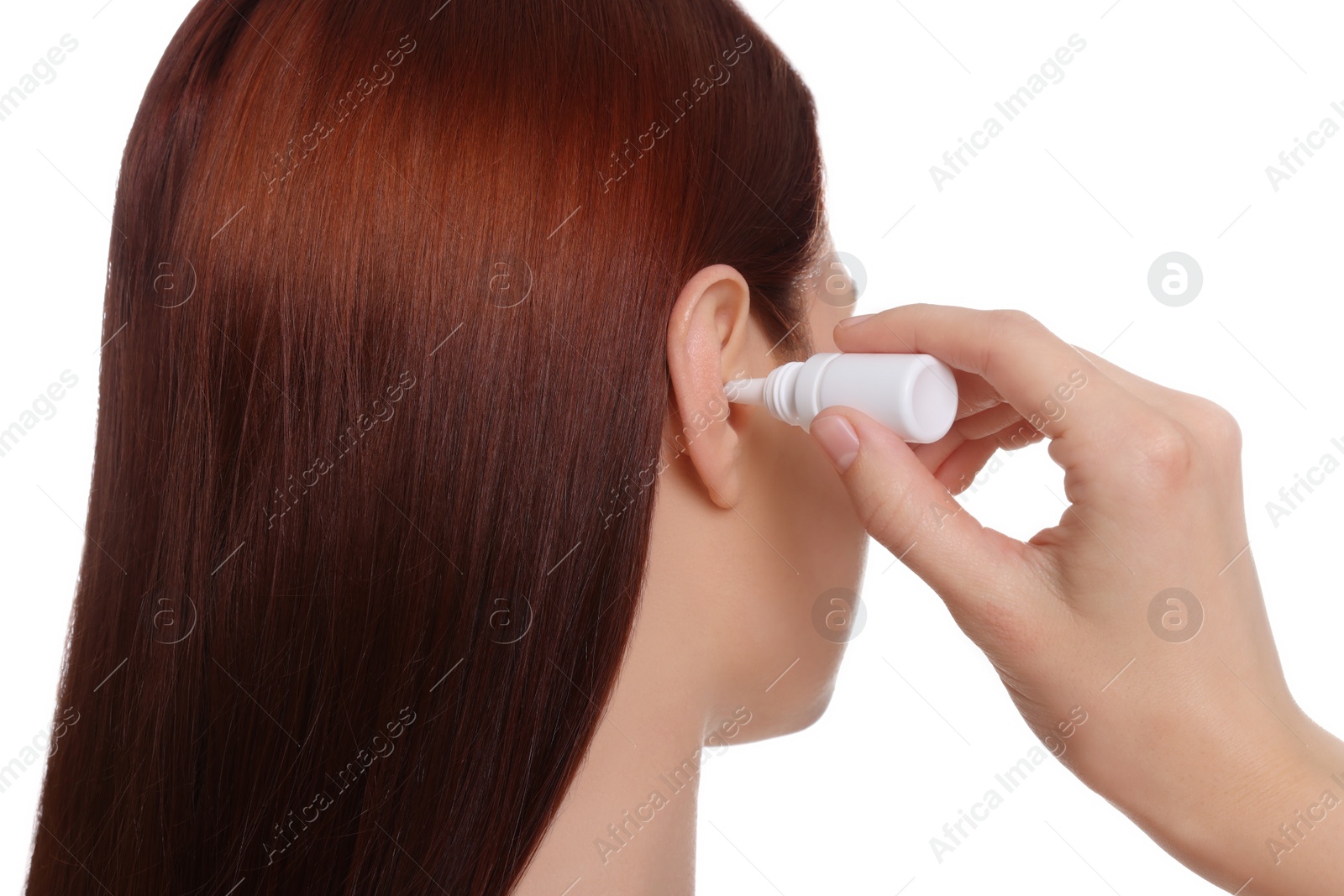 Photo of Woman using ear drops on white background
