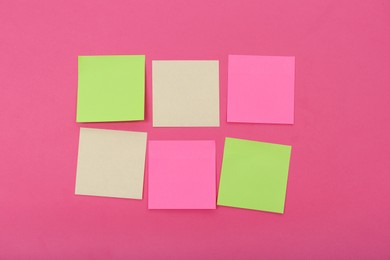 Blank colorful stickers on pink background, flat lay