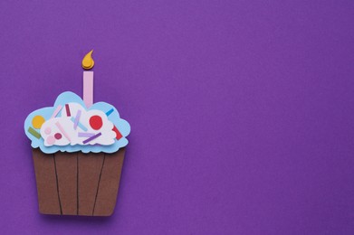 Birthday party. Paper cupcake on purple background, top view with space for text