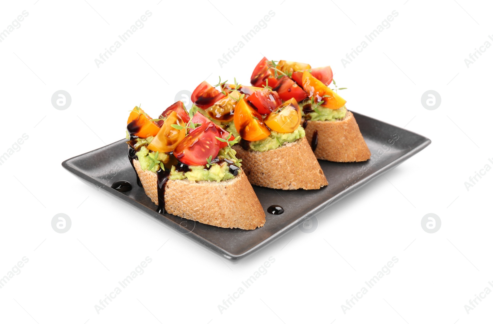 Photo of Delicious bruschettas with avocado, tomatoes and balsamic vinegar isolated on white