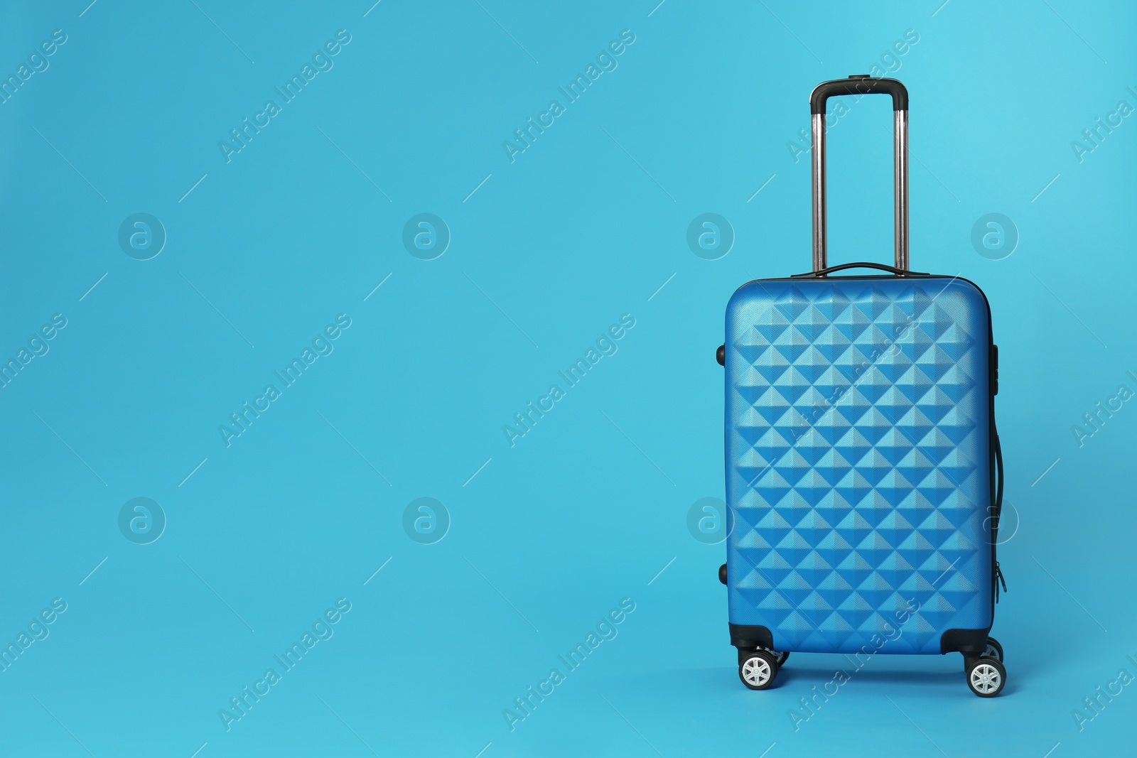 Photo of Stylish suitcase on color background. Space for text