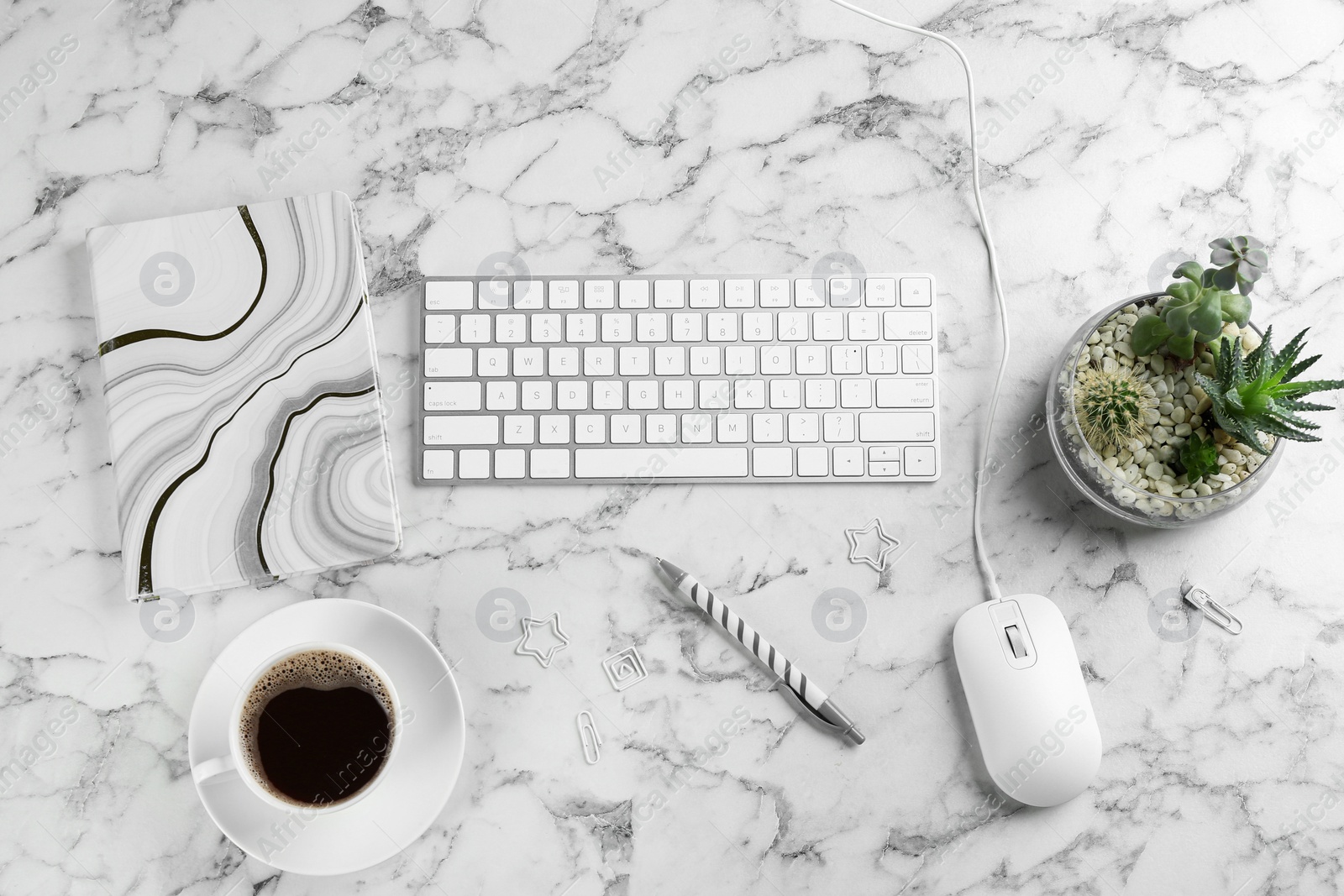 Photo of Flat lay composition with mouse and keyboard on white marble table