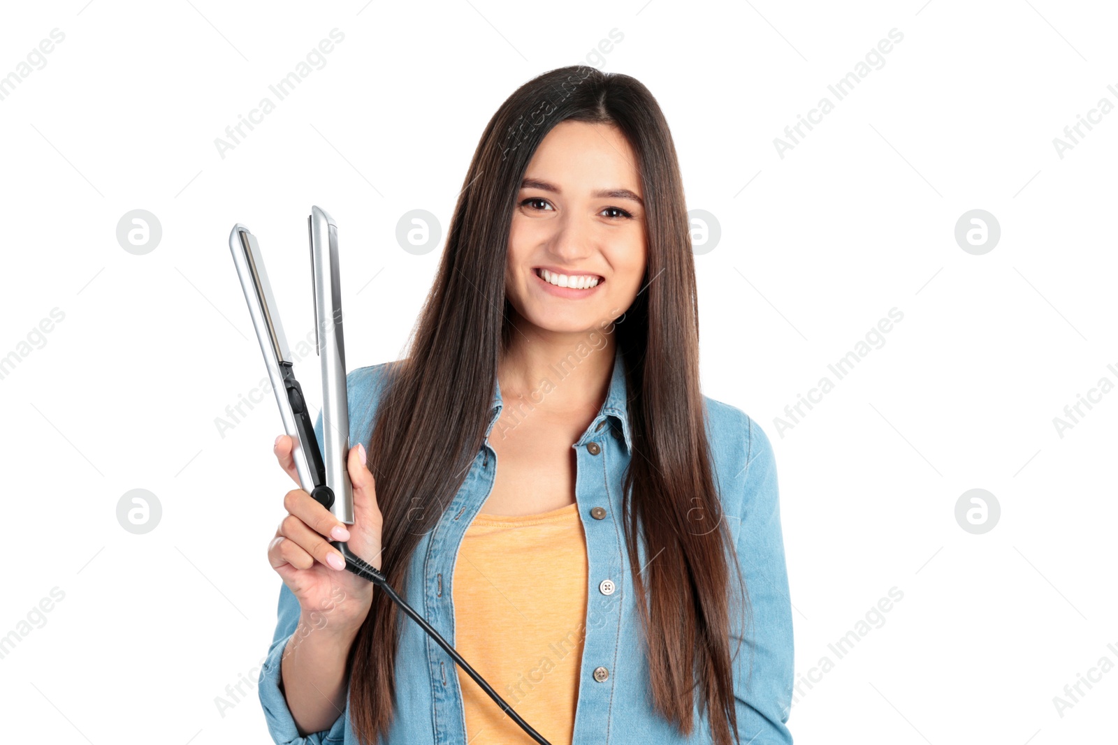 Photo of Young woman with modern hair iron on white background