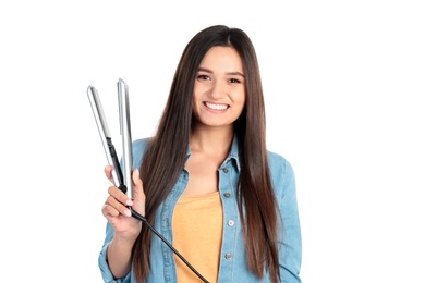 Young woman with modern hair iron on white background