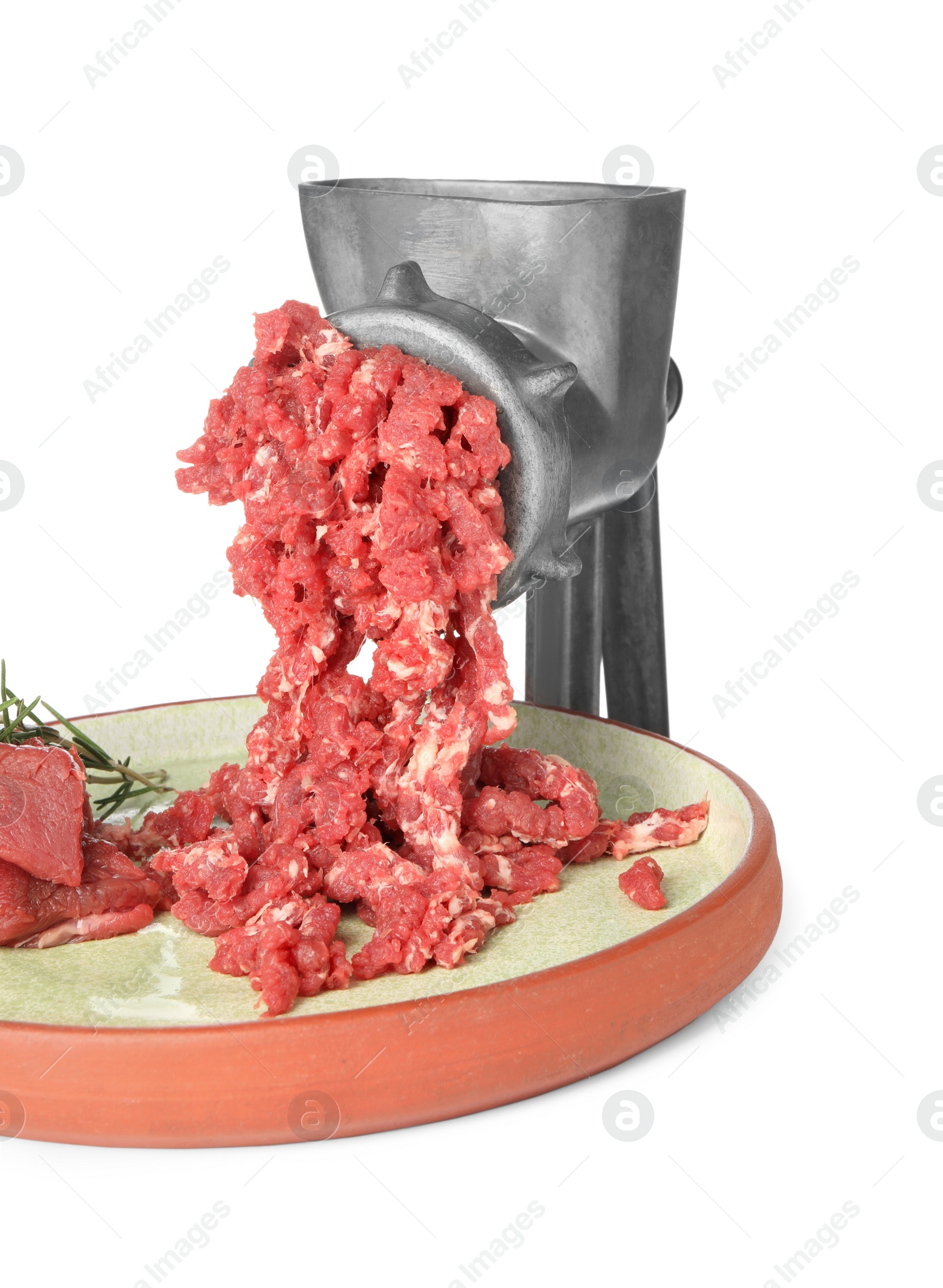 Photo of Metal meat grinder with minced beef and plate isolated on white