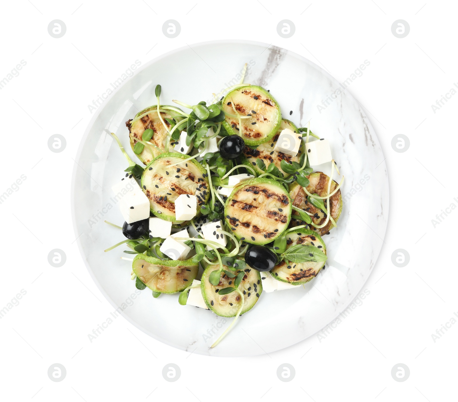 Photo of Delicious salad with grilled zucchini slices, feta cheese and olives on white background, top view