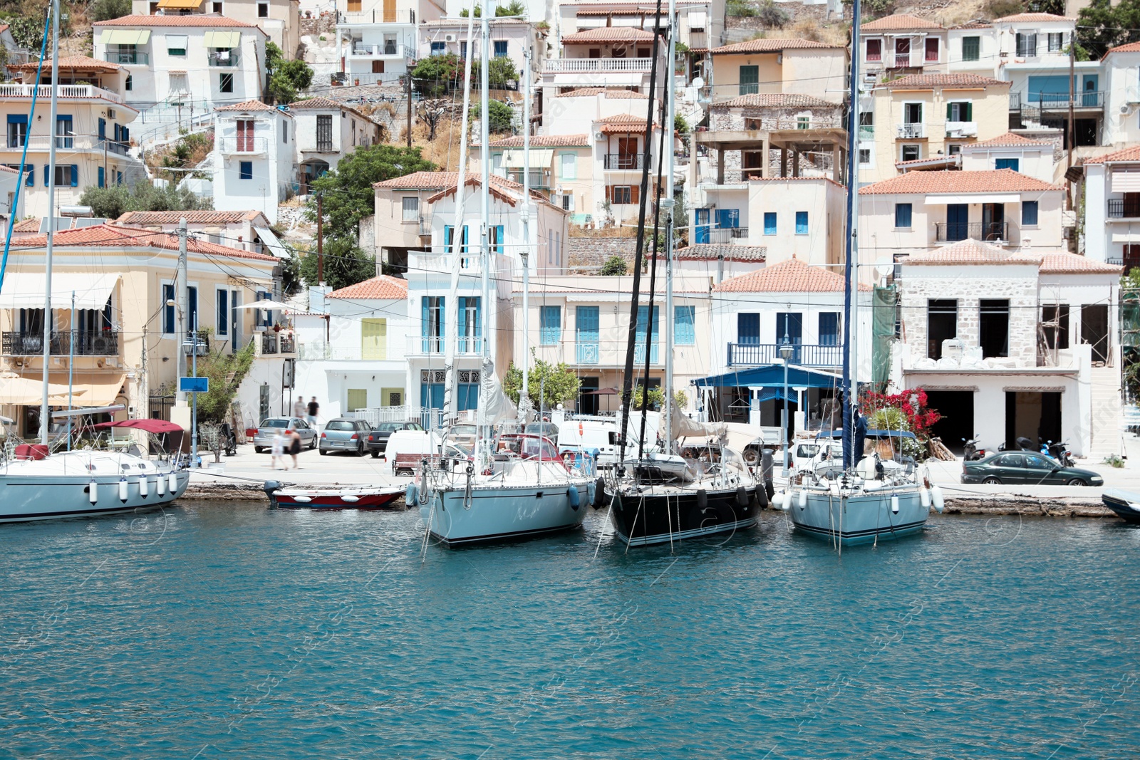 Photo of Beautiful view of coastal city with boats on sunny day