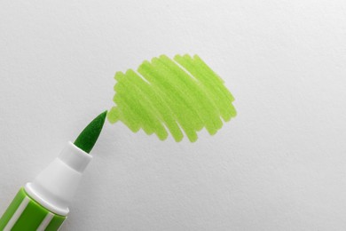 Photo of Stroke drawn with light green marker and highlighter isolated on white, top view