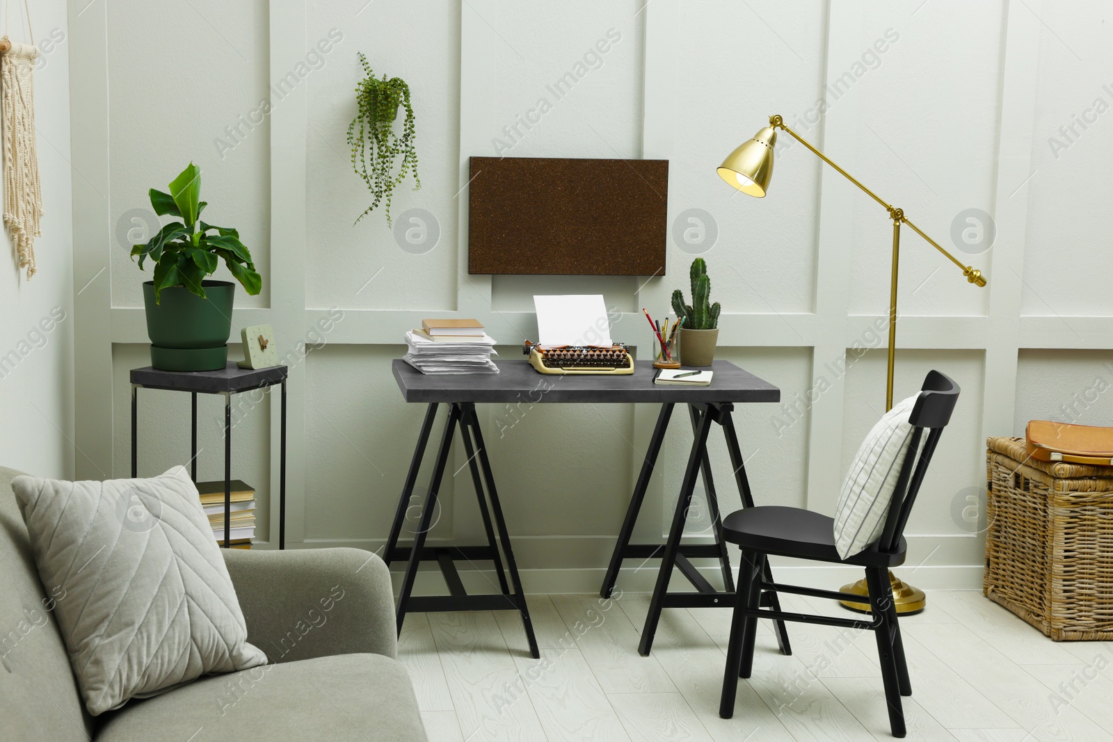 Photo of Writer's workplace with typewriter on dark table desk in room