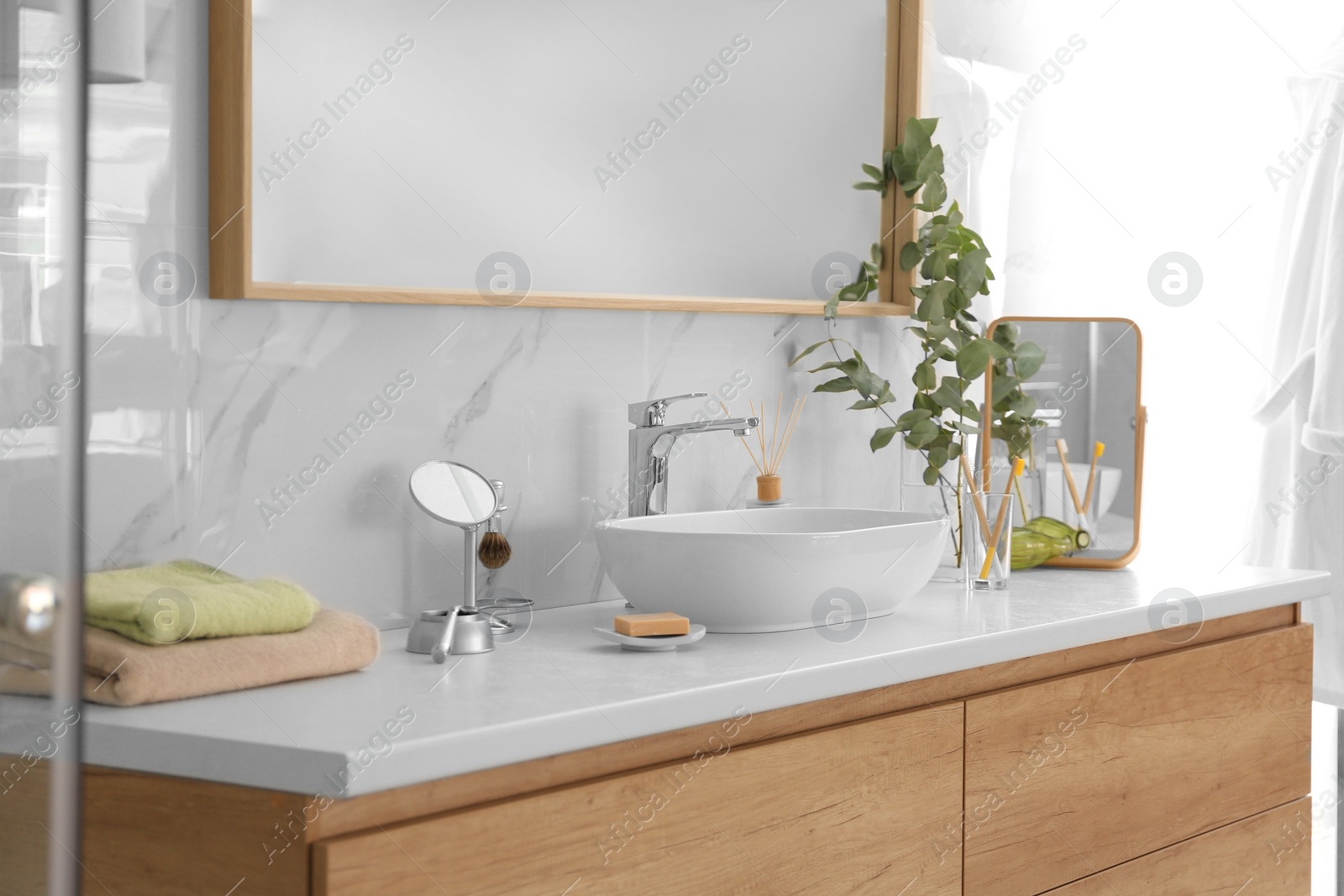 Photo of Modern bathroom interior with vessel sink and big mirror