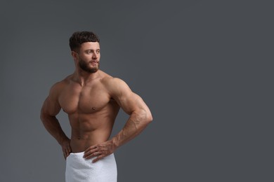 Handsome muscular man on grey background, space for text. Sexy body