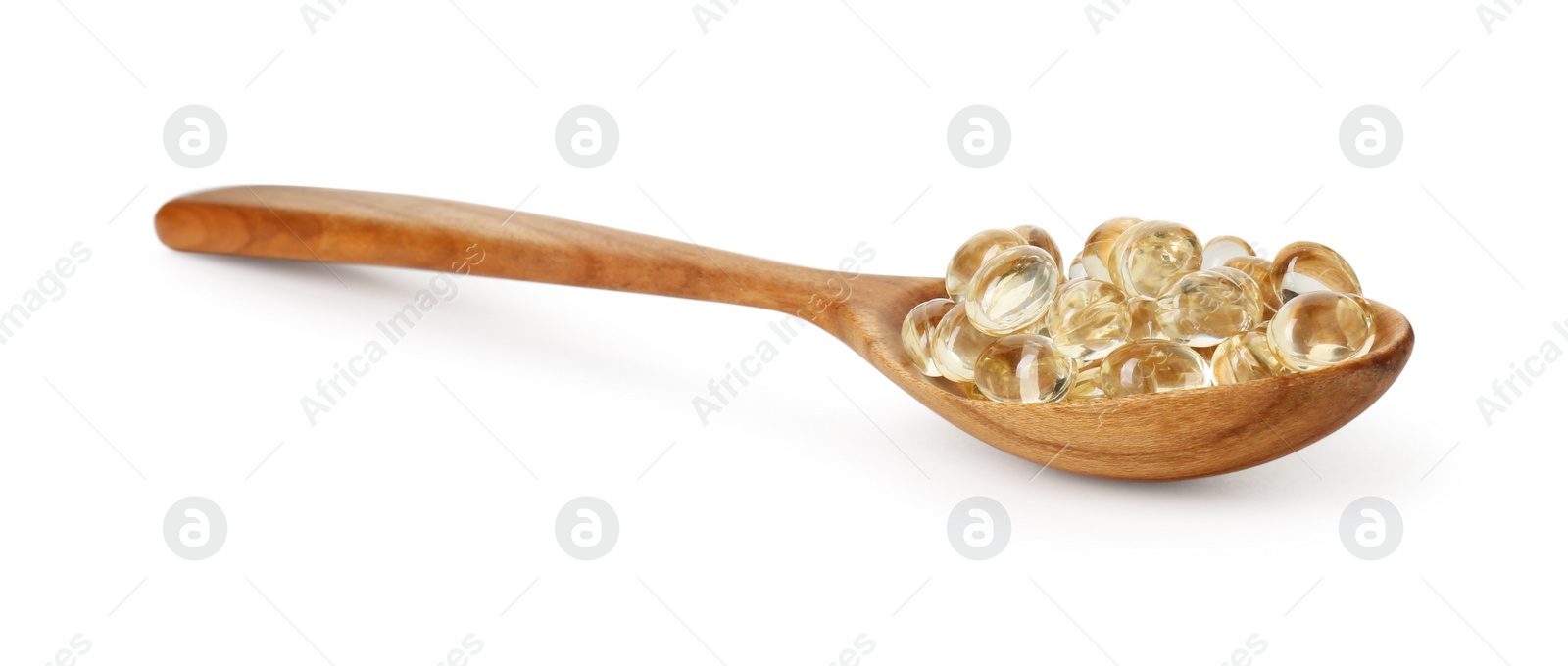 Photo of Vitamin capsules in wooden spoon isolated on white. Health supplement