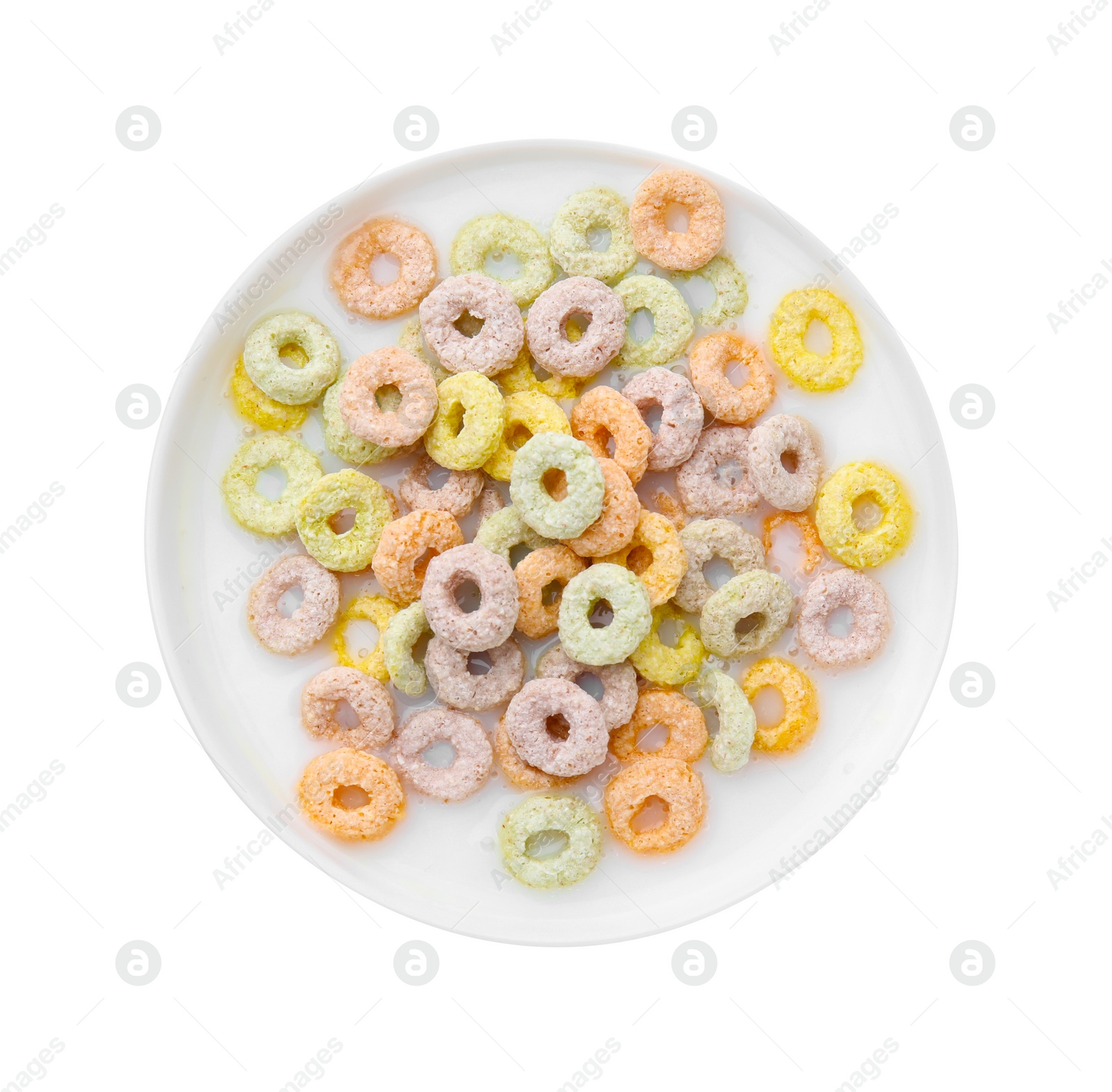 Photo of Tasty colorful cereal rings and milk in bowl on white background, top view