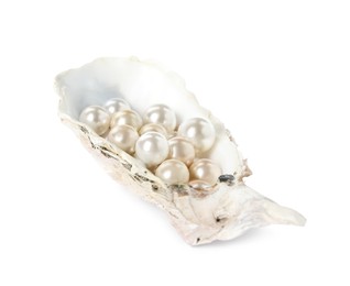 Photo of Oyster shell with different pearls on white background