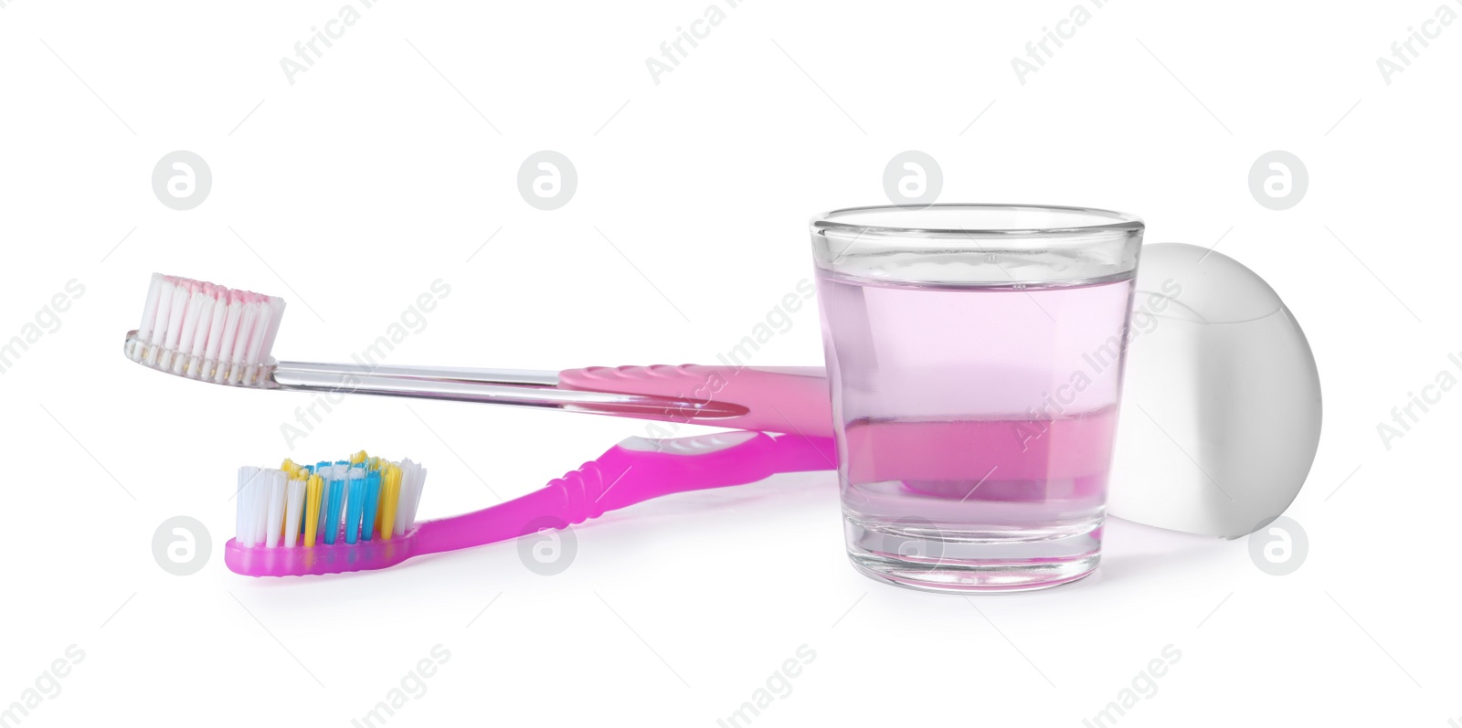 Photo of Mouthwash and other items for teeth care on white background