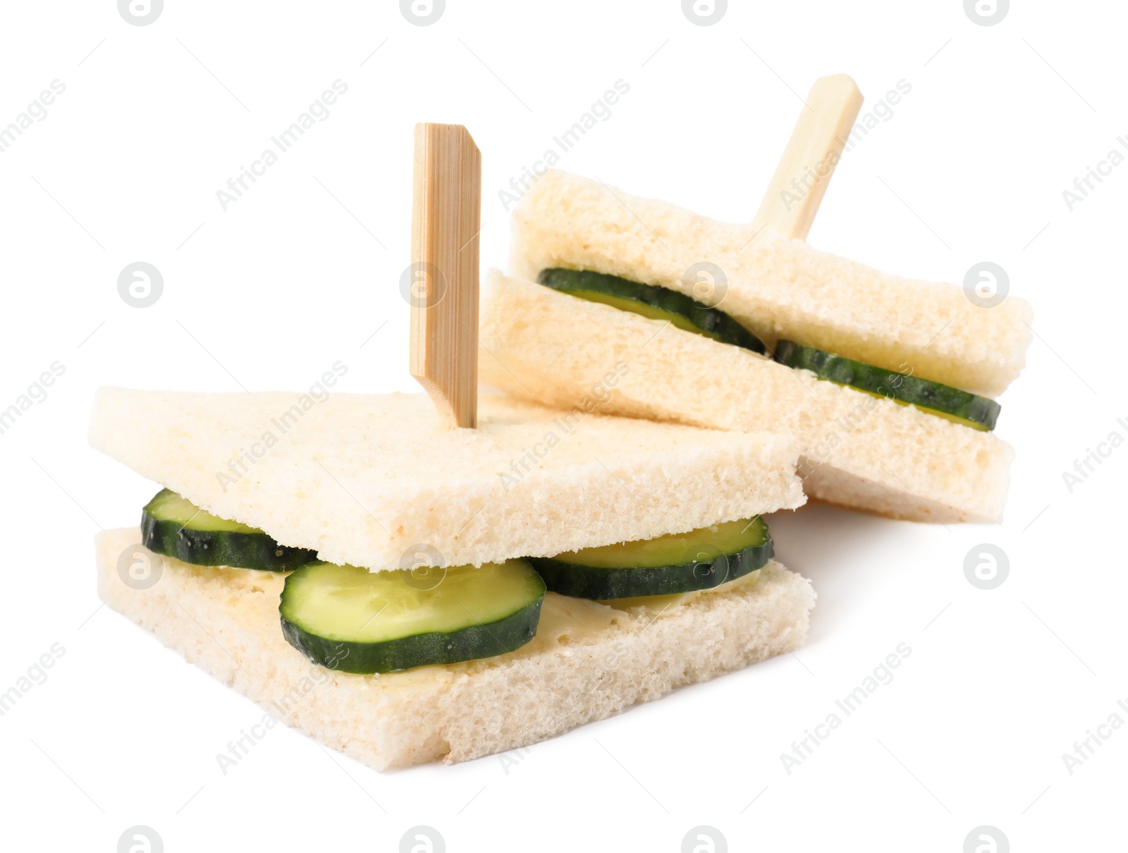 Photo of Tasty fresh cucumber sandwiches on white background