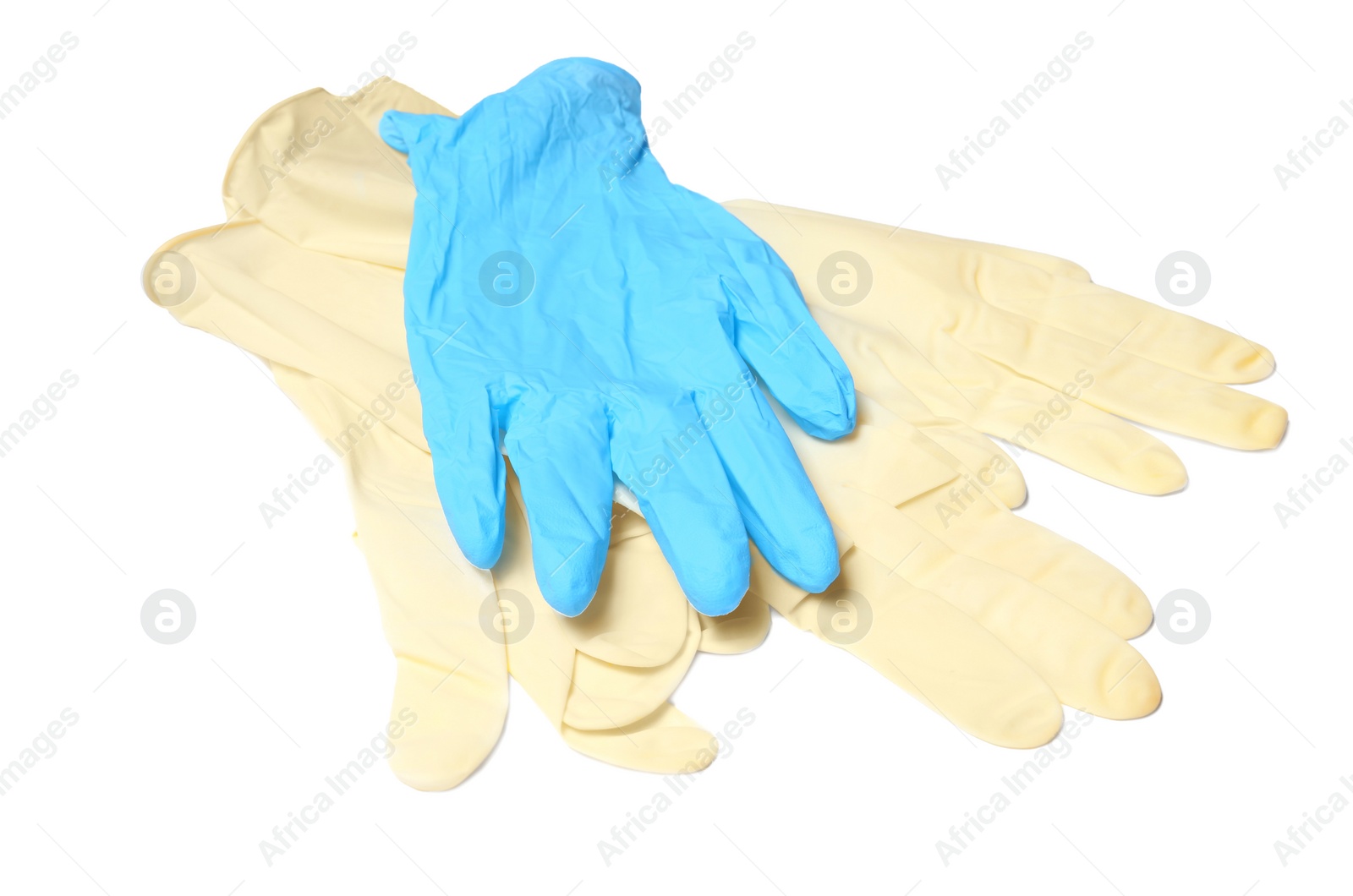 Photo of Different protective gloves on white background. Medical item