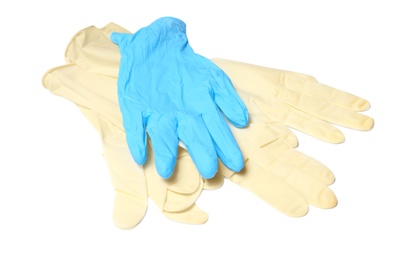 Photo of Different protective gloves on white background. Medical item