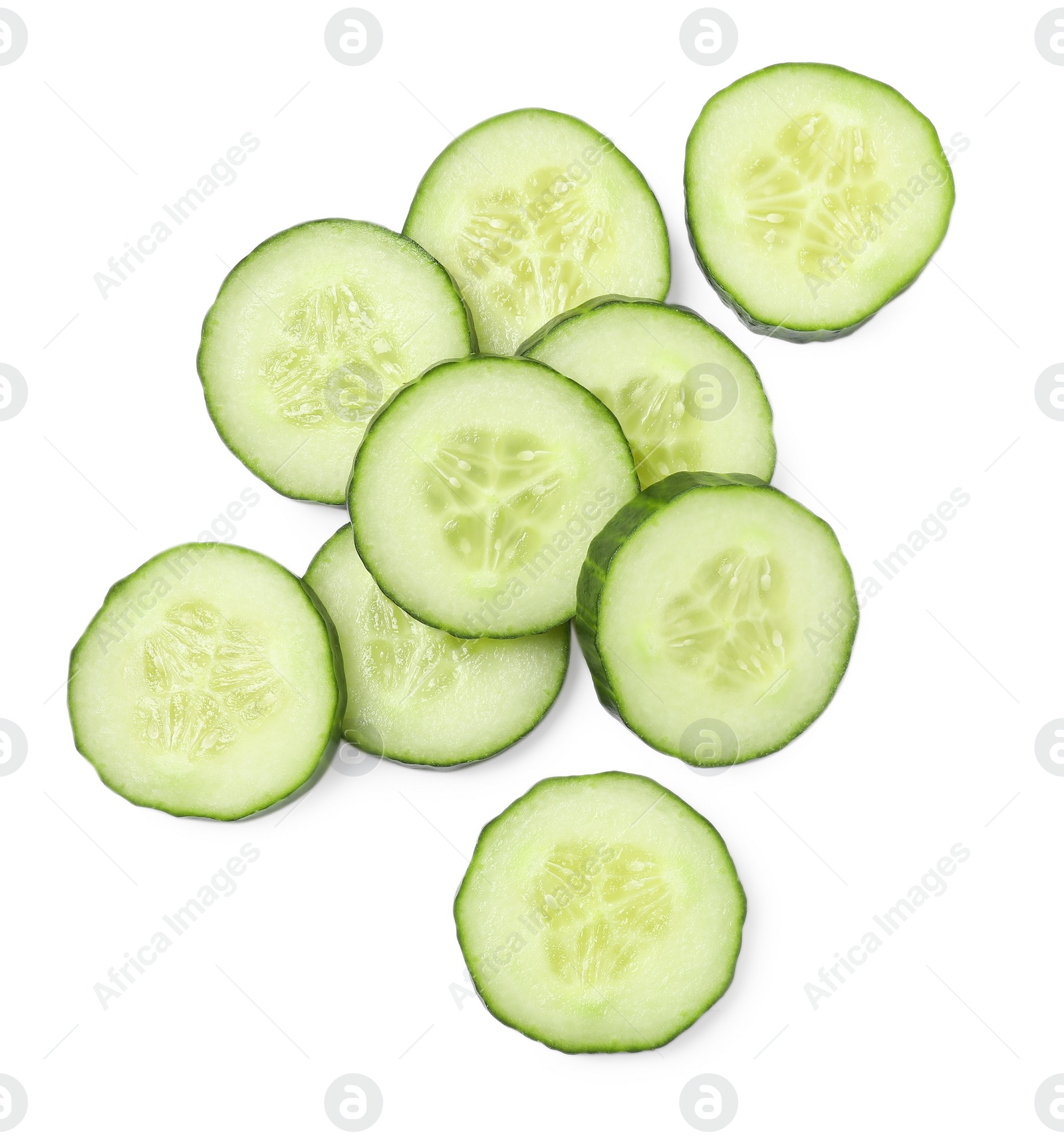 Photo of Pile of fresh cut cucumber isolated on white, top view