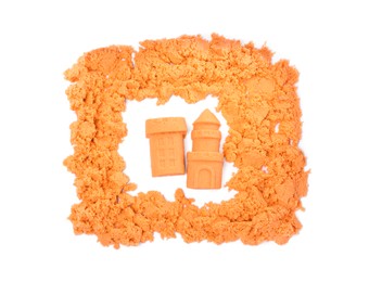 Castle and tower made of kinetic sand on white background, top view