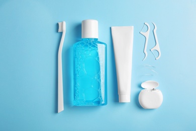 Photo of Flat lay composition with oral care products on color background. Teeth hygiene