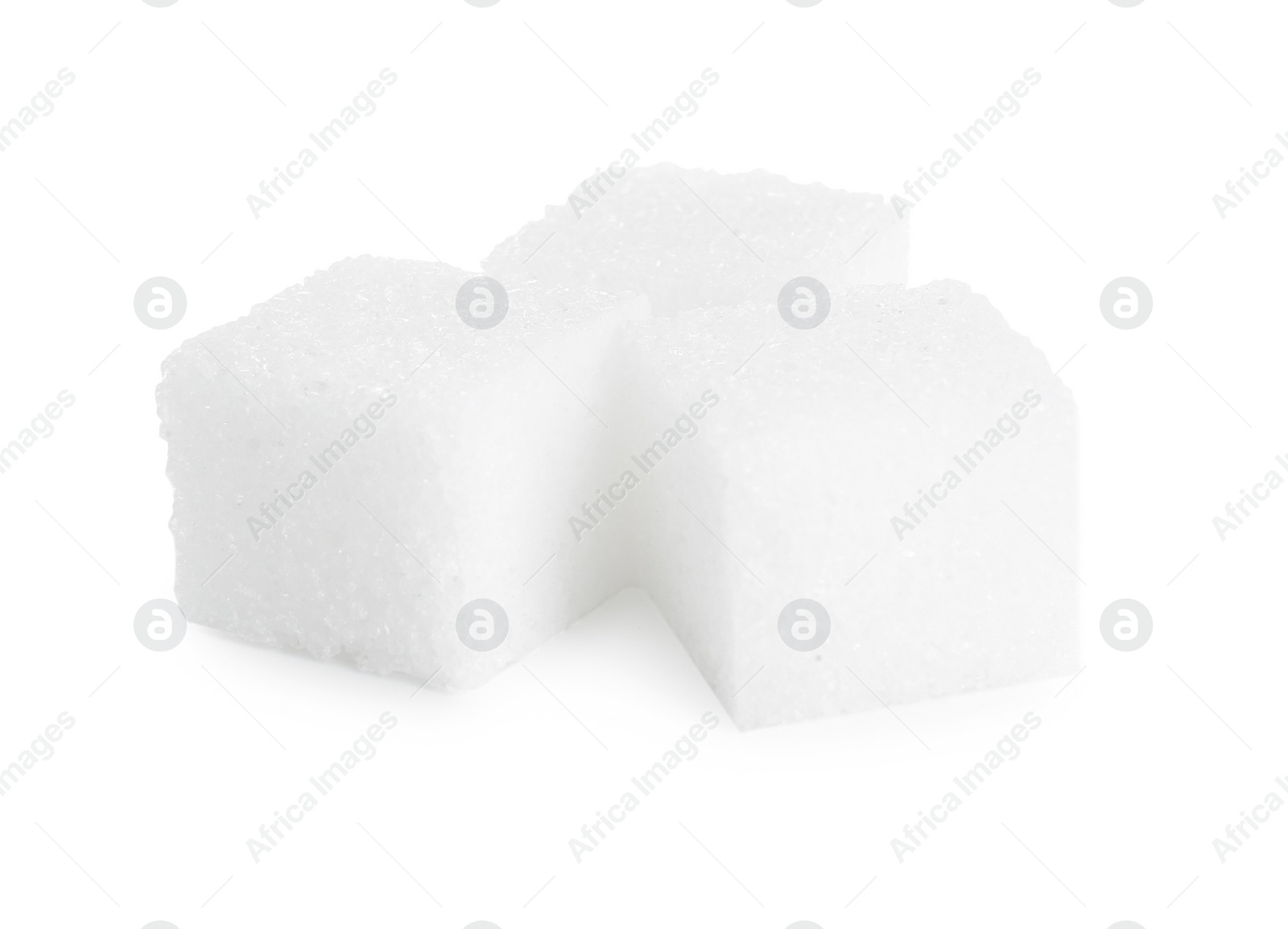 Photo of Three refined sugar cubes isolated on white