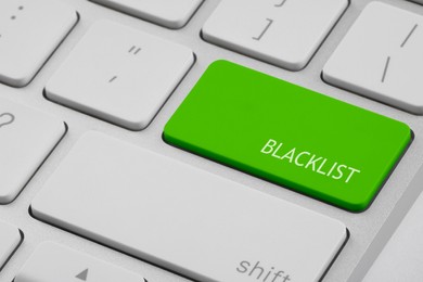 Green button with word Blacklist on computer keyboard, closeup