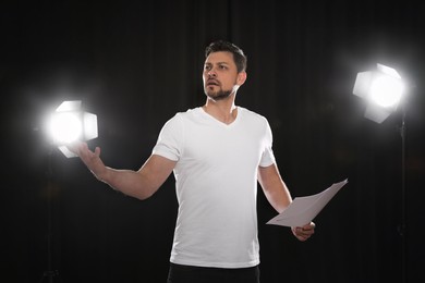 Professional actor rehearsing on stage in theatre