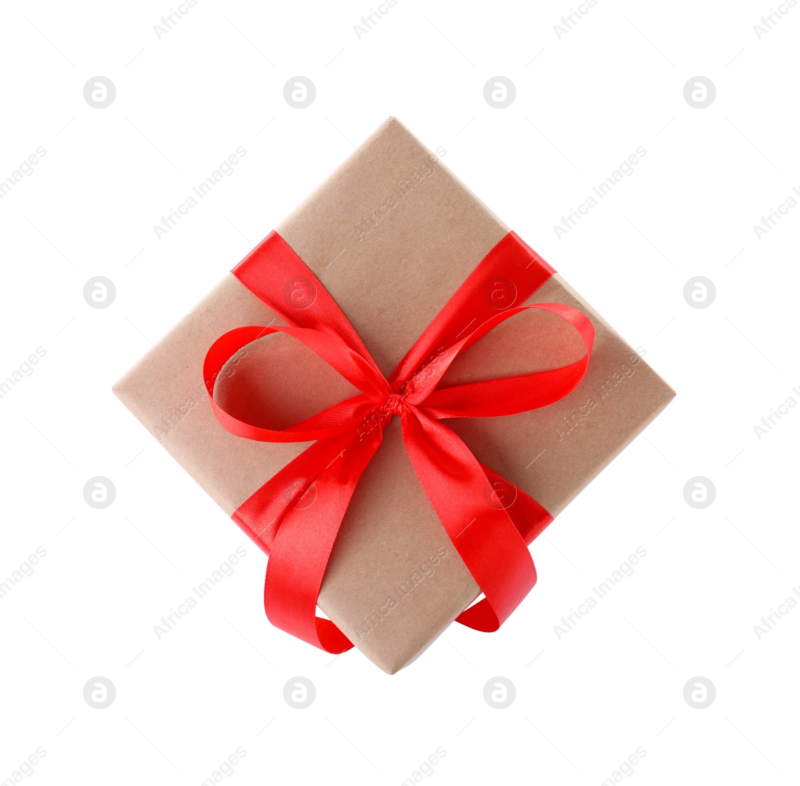 Photo of Christmas gift box decorated with ribbon bow on white background, top view