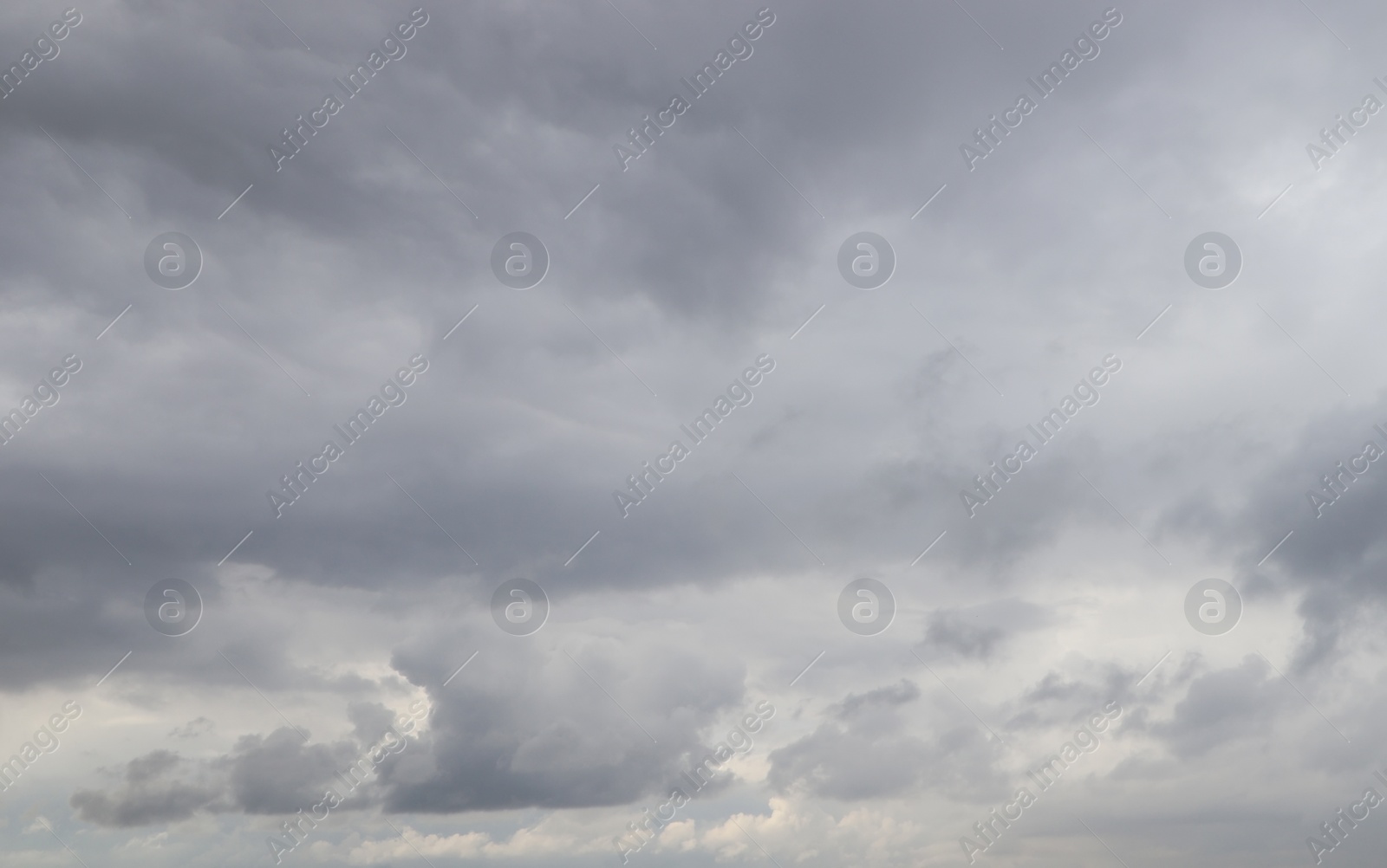 Photo of Sky with heavy rainy clouds on grey day