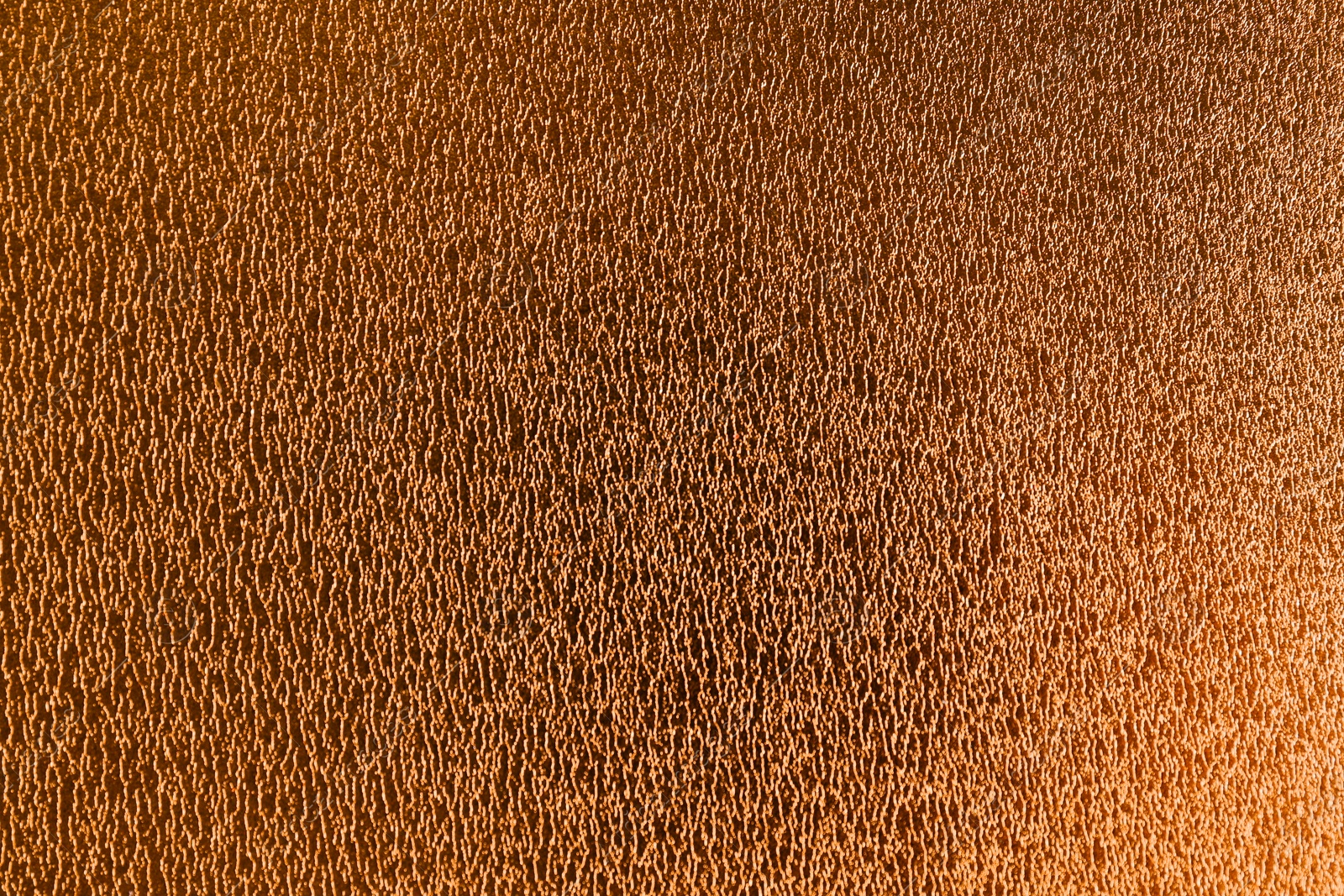 Photo of Golden textured surface as background, closeup view
