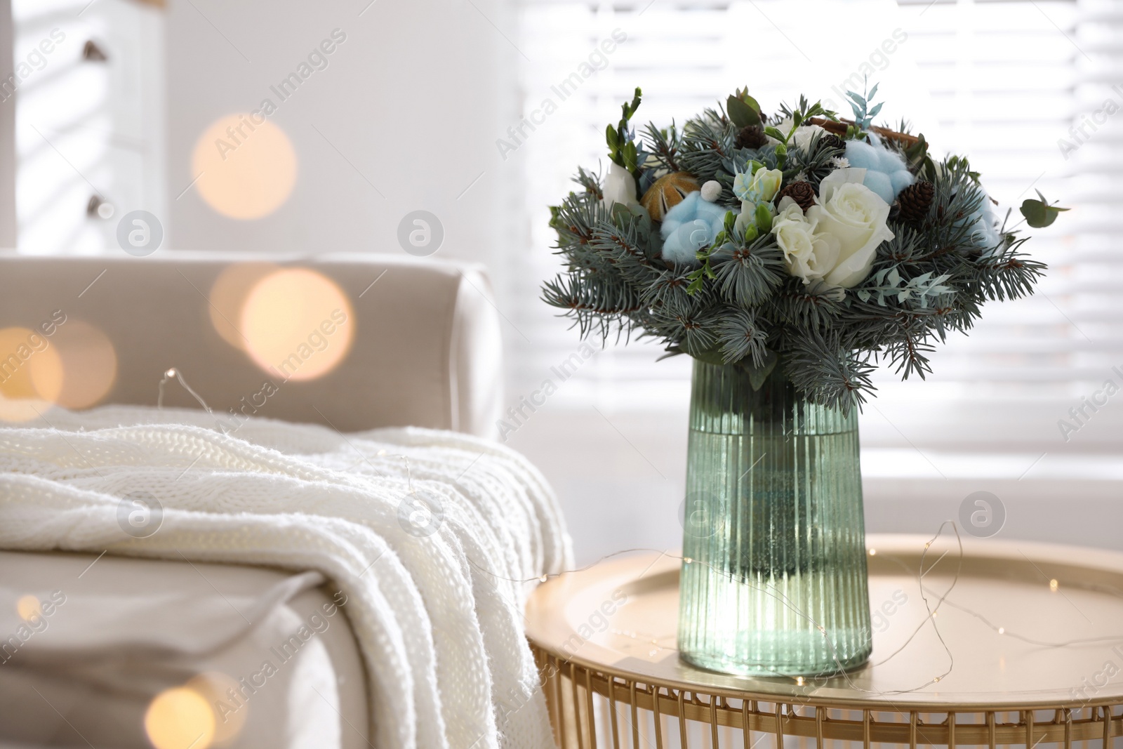 Photo of Beautiful wedding winter bouquet on table indoors. Space for text