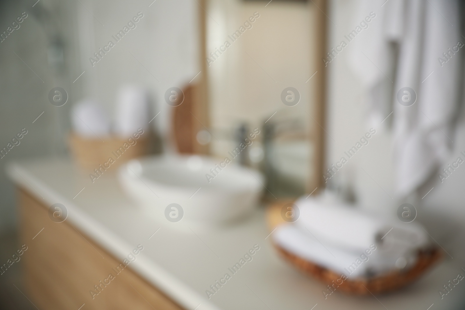 Photo of Blurred view of light modern bathroom interior