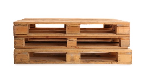 Photo of Stacked wooden pallets isolated on white. Transportation and storage