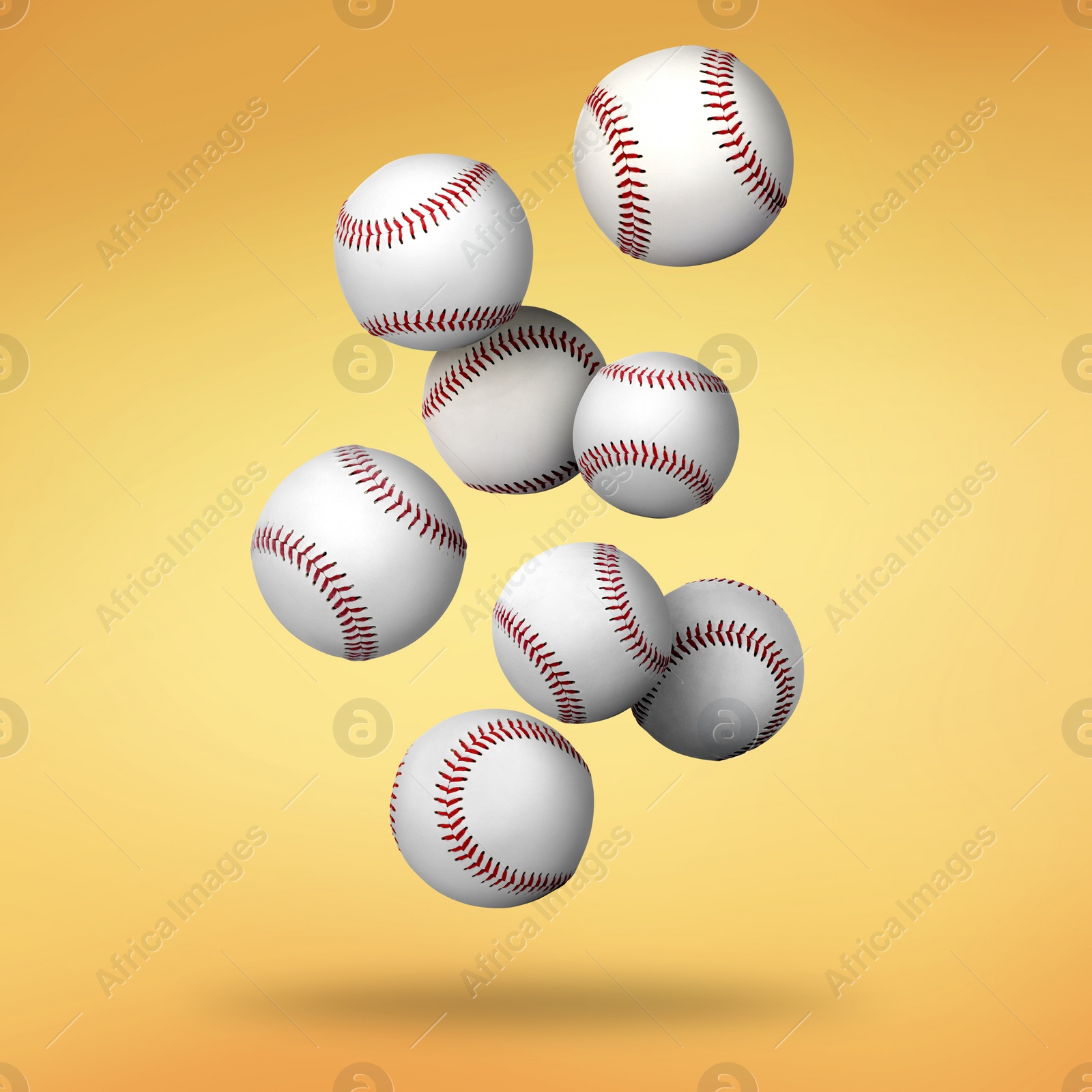 Image of Many baseball balls falling on golden gradient background