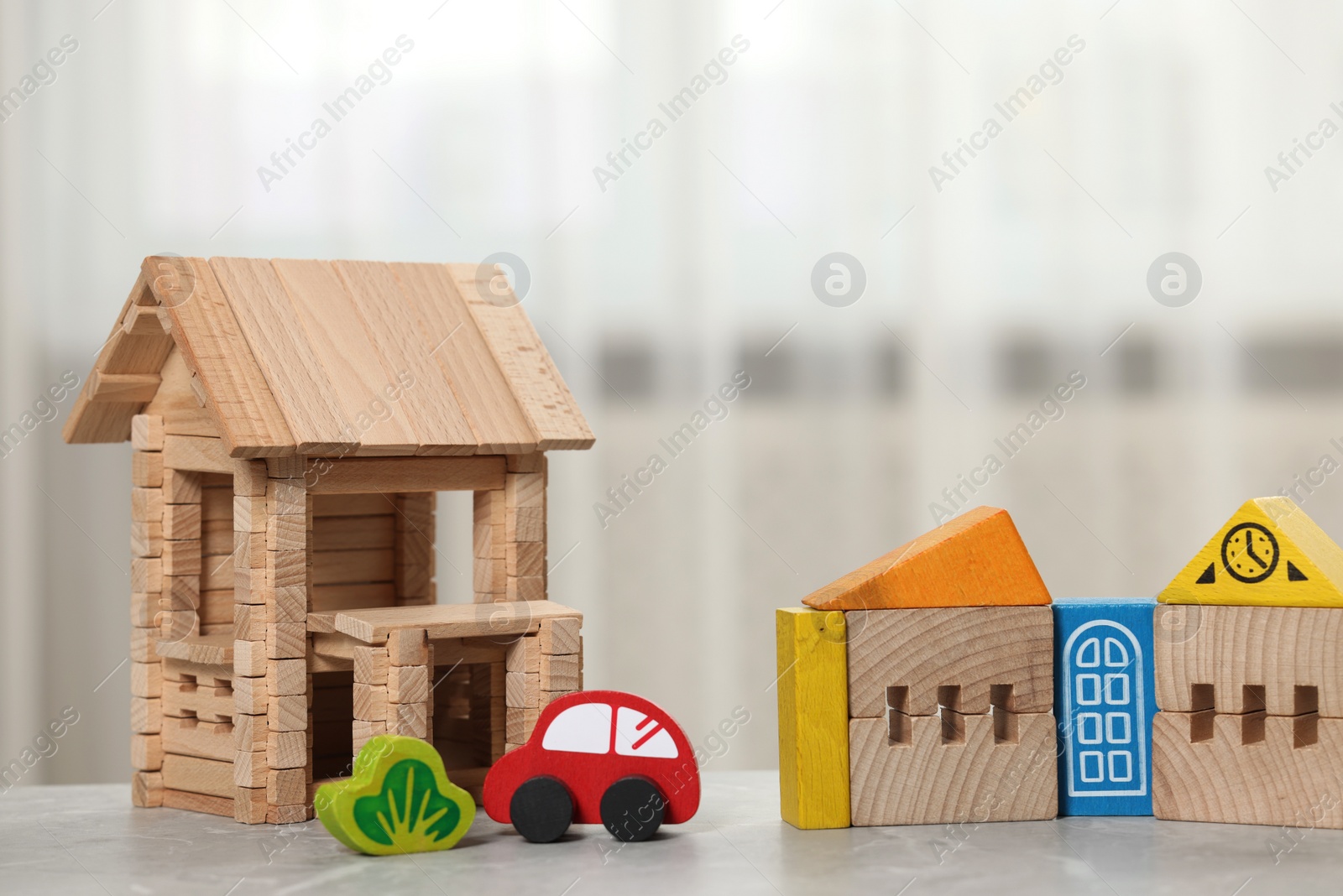 Photo of Set of wooden toys on table indoors, closeup. Children's development