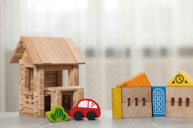 Set of wooden toys on table indoors, closeup. Children's development