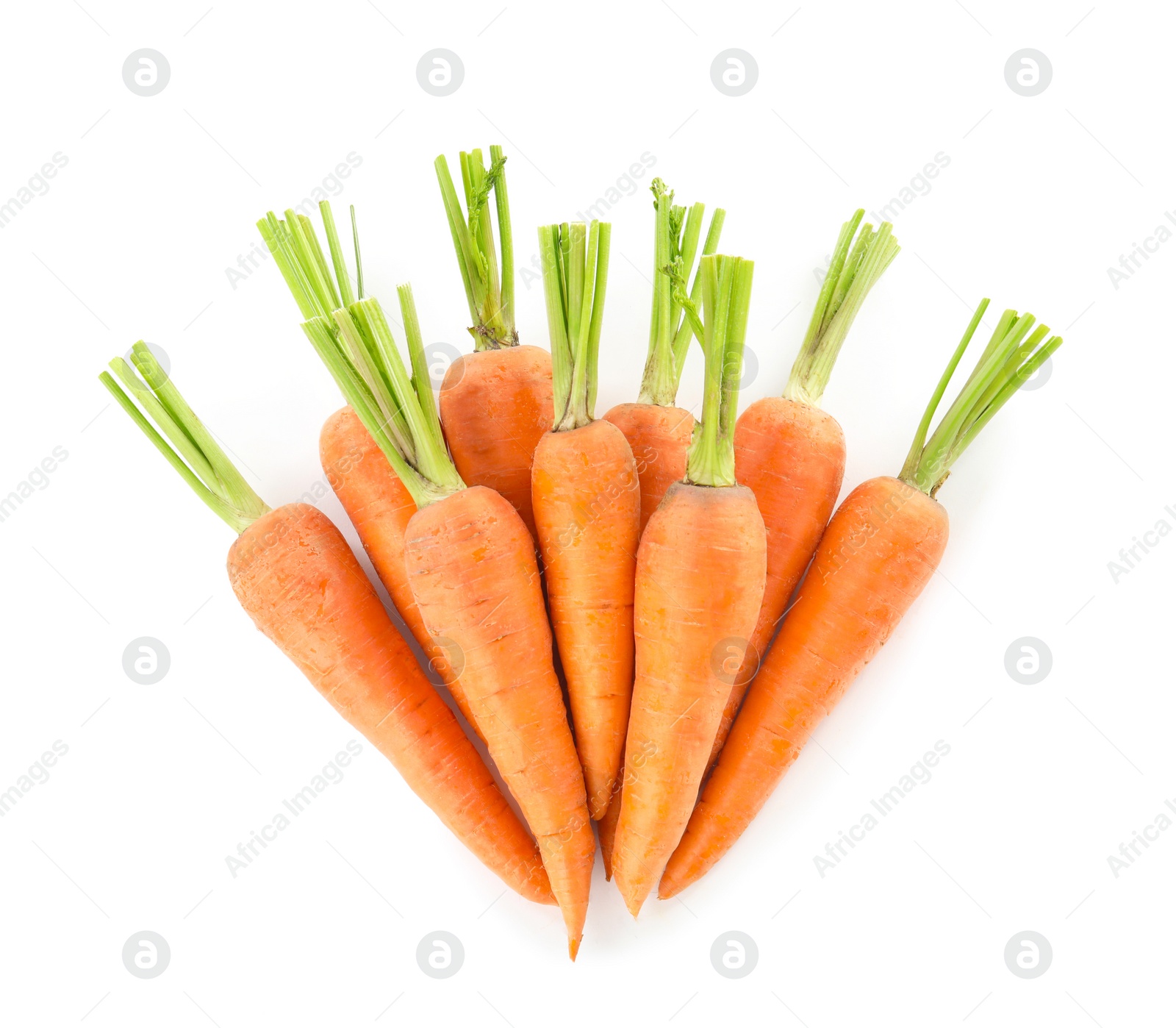 Photo of Pile of fresh ripe carrots isolated on white, top view