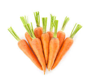 Pile of fresh ripe carrots isolated on white, top view