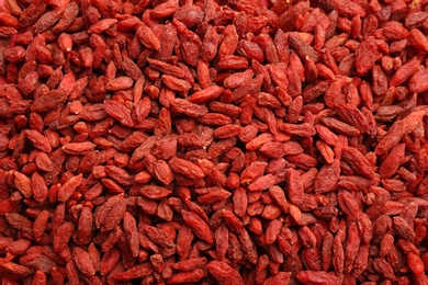 Many dried goji berries as background, top view. Healthy superfood