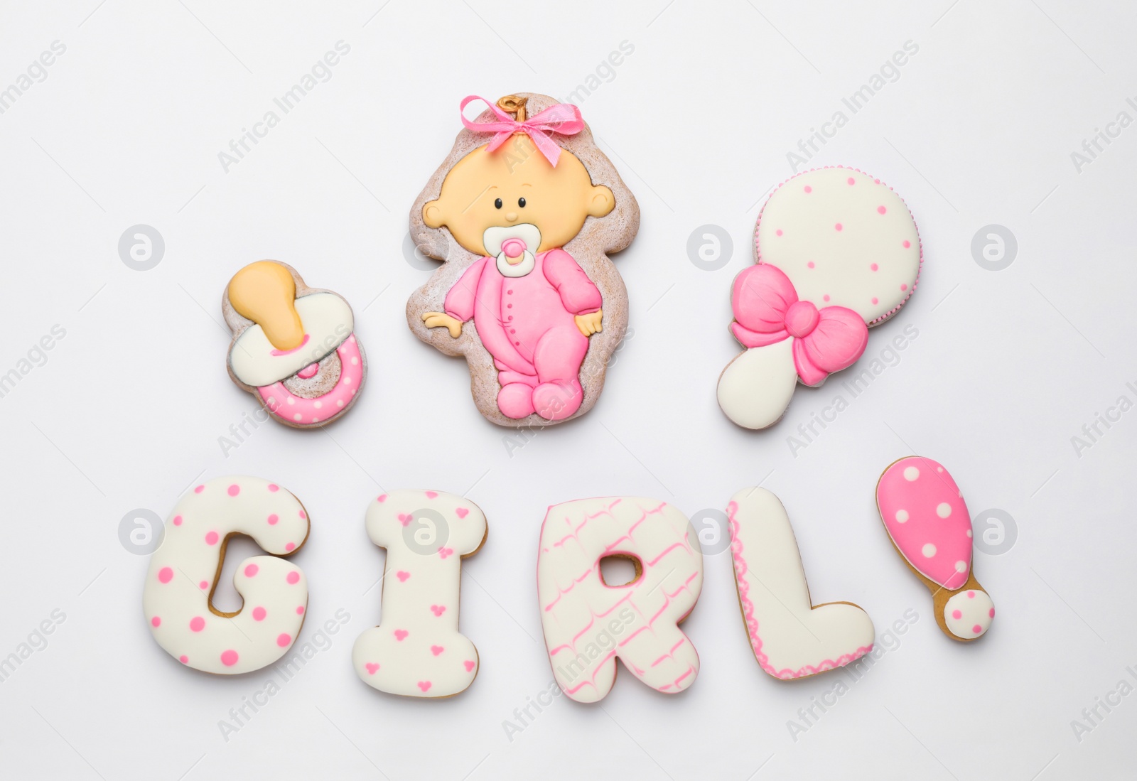 Photo of Word GIRL made of tasty cookies on white background, top view. Baby shower party