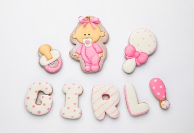 Word GIRL made of tasty cookies on white background, top view. Baby shower party