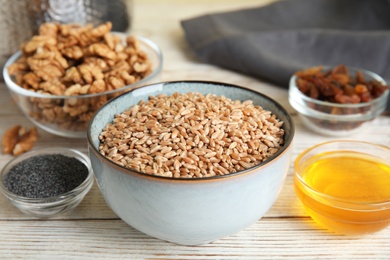 Photo of Ingredients for traditional kutia on light wooden table