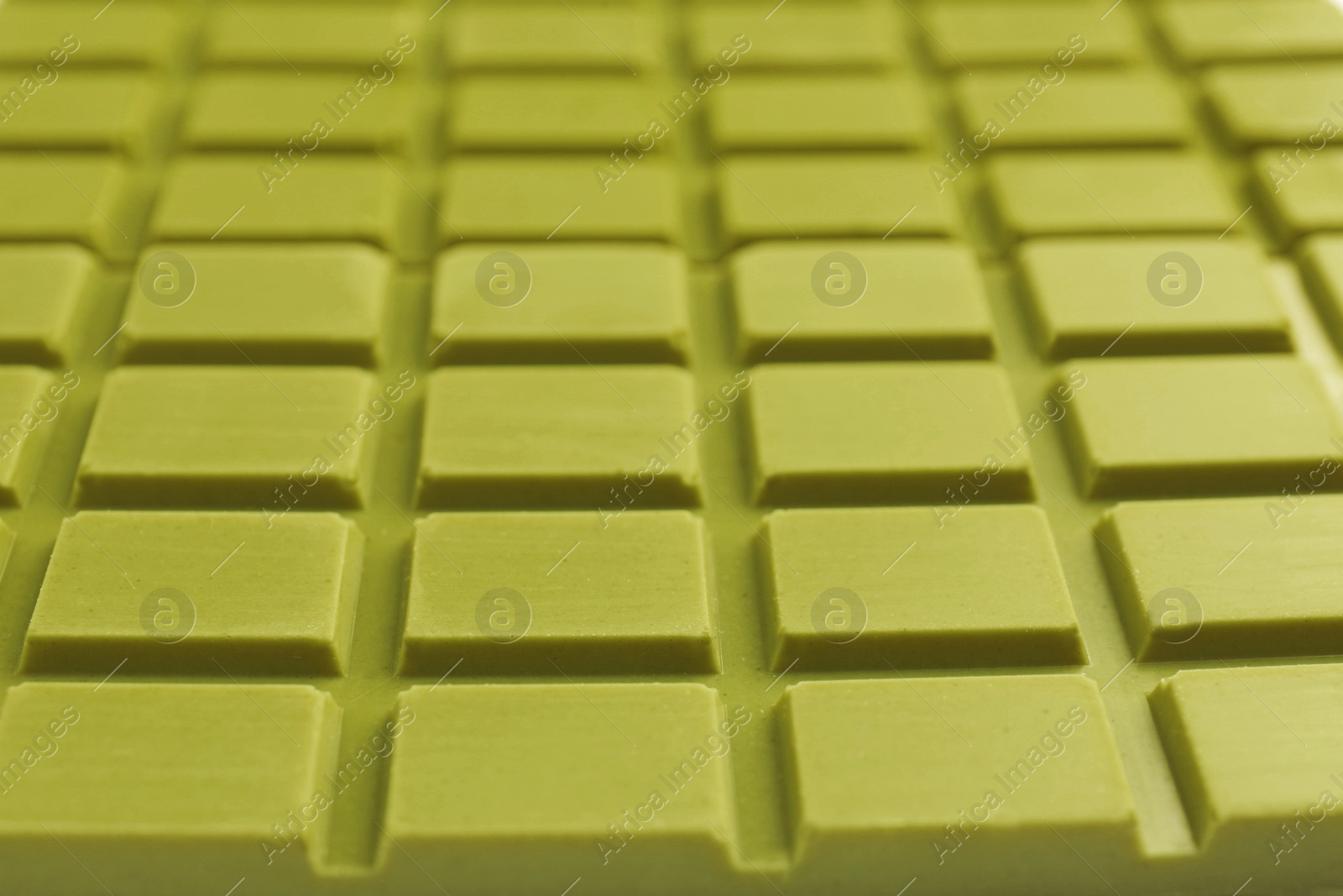 Photo of Tasty matcha chocolate bar as background, closeup