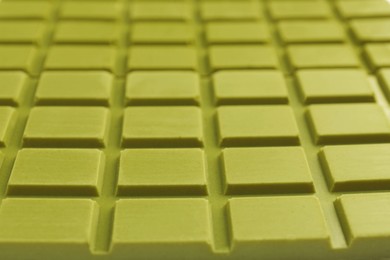 Tasty matcha chocolate bar as background, closeup