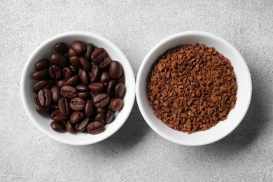 Photo of Bowls with roasted beans and instant coffee on light grey table, flat lay