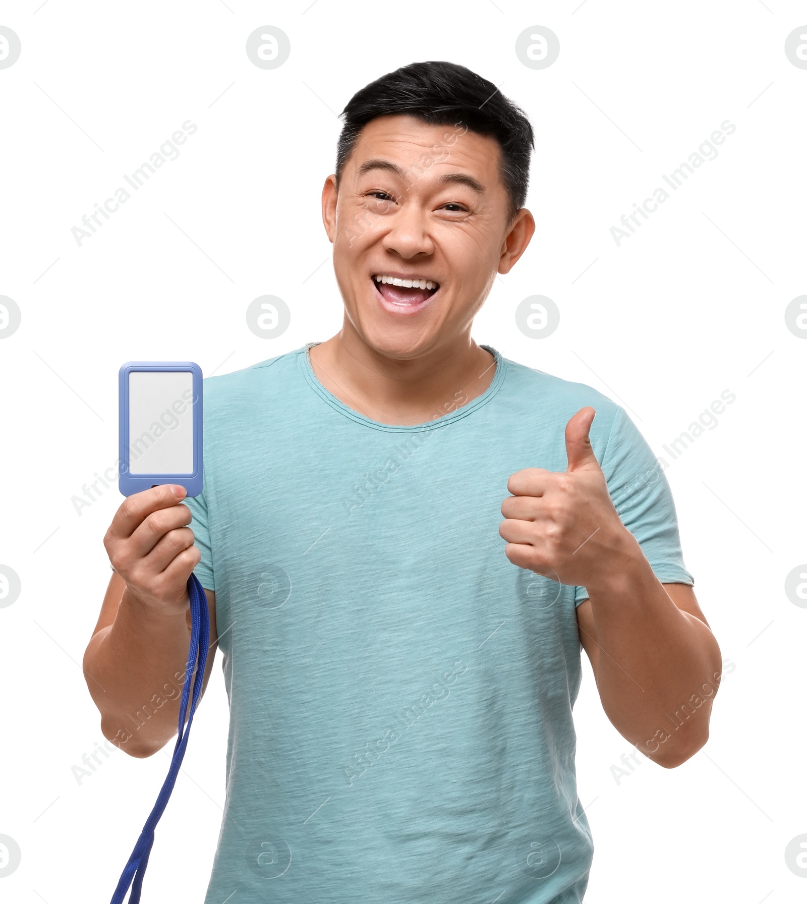 Photo of Happy asian man with vip pass badge showing thumbs up on white background